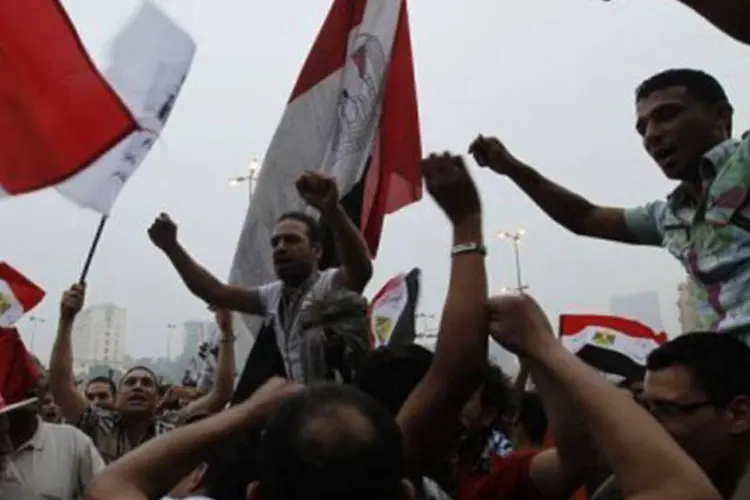 Simpatizantes da Irmandade Muçulmana comemoram anúncio de resultados
 (Mohammed Abed/AFP)