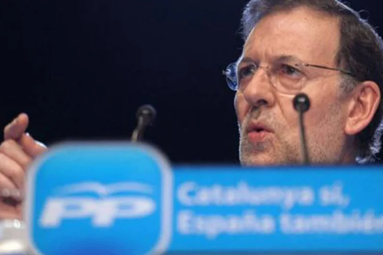 
	O primeiro-ministro espanhol, Mariano Rajoy: &quot;o d&eacute;ficit p&uacute;blico j&aacute; est&aacute; se reduzindo, as reformas, particularmente a do mercado de trabalho, j&aacute; come&ccedil;am a produzir efeitos&quot;
 (Lluis Gene/AFP)