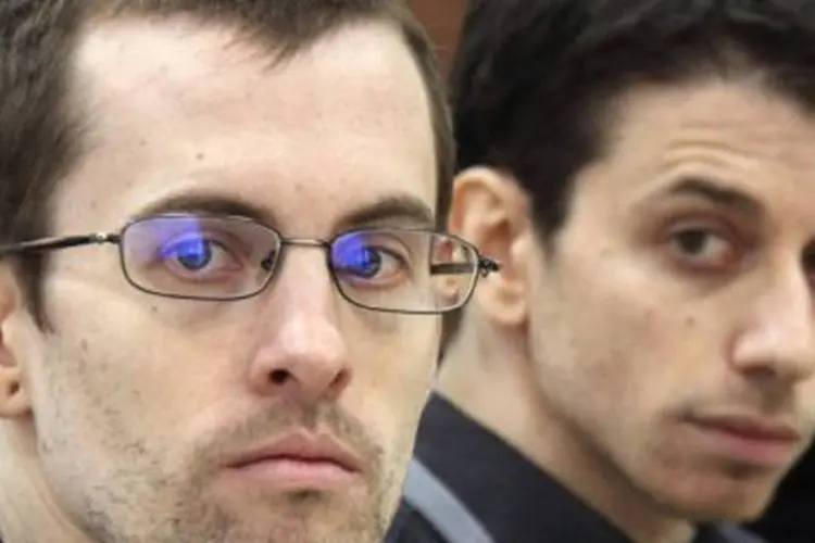Shane Bauer e Josh Fattal foram condenados a oitos anos de prisão cada um sob a acusação de espionagem
 (AFP/Press TV)