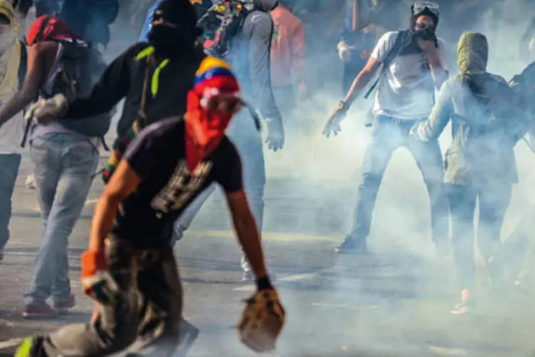 
	Desde fevereiro, a Venezuela &eacute; cen&aacute;rio de protestos contra o governo, que deixaram 42 mortos e 800 feridos
 (JUAN BARRETO/AFP Photow)
