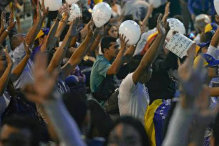 
	Estudantes protestam contra o governo da Venezuela, em Caracas
 (Juan Barreto/AFP)