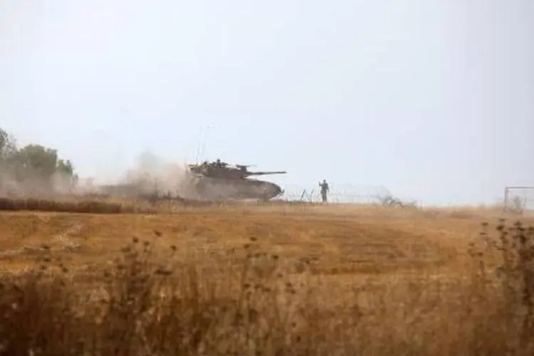 Soldados israelenses participam de exercício militar, na fronteira da Faixa de Gaza e Israel (Menahem Kahana/AFP)