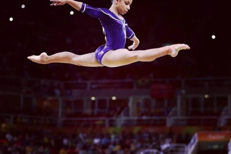 
	Fl&aacute;via Saraiva: &quot;no caso da gin&aacute;stica art&iacute;stica, os baixos com coxas fortes levam vantagem por terem mais equil&iacute;brio em traves e menos peso para o apoio&quot;, diz m&eacute;dico especialista
 (Lars Baron/Equipa/Getty Images)