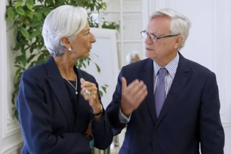 A diretora-gerente do FMI, Christine Lagarde conversa com seu advogado (Thomas Samson/AFP)