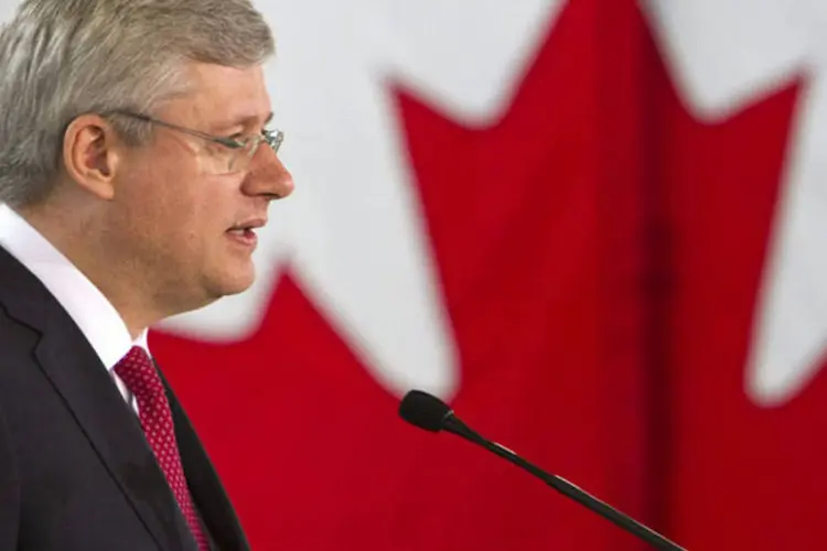 
	O primeiro-ministro do Canad&aacute;, Stephen Harper: autoridade monet&aacute;ria destacou que o balan&ccedil;o de riscos &quot;permanece dentro da zona para o qual a posi&ccedil;&atilde;o da atual pol&iacute;tica monet&aacute;ria &eacute; apropriada&quot;
 (Ben Nelms/Reuters)