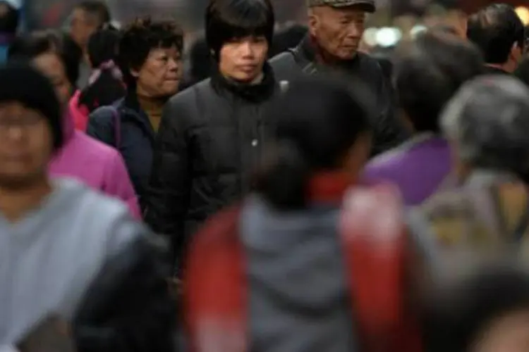 Pessoas na China:os crimes de Li Hao, preso em setembro de 2011, chocaram a população chinesa (Dale de la Rey/AFP)