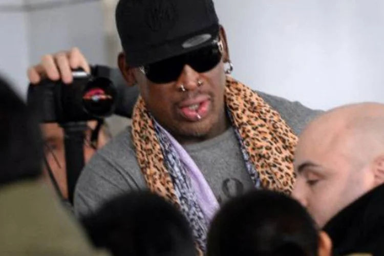 
	Dennis Rodman: &quot;Isso n&atilde;o &eacute; sobre mim. Se eu puder abrir a porta um pouco, s&oacute; um pouco&quot;
 (Goh Chai Hin/AFP)