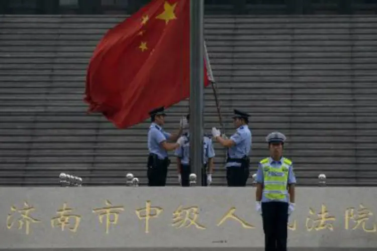 
	Bandeira da China: o sistema penal at&eacute; ent&atilde;o em vigor permitia a Pequim enviar condenados a esses campos por at&eacute; quatro anos sem os devidos tr&acirc;mites judiciais
 (Mark Ralston/AFP)