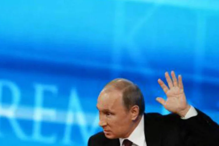 O presidente russo, Vladimir Putin, em discurso: ao ser questionado se já tinha em mente o nome de um sucessor, ele respondeu: "eu não disse nada e não há nada a dizer" (Vasily Maximov/AFP)