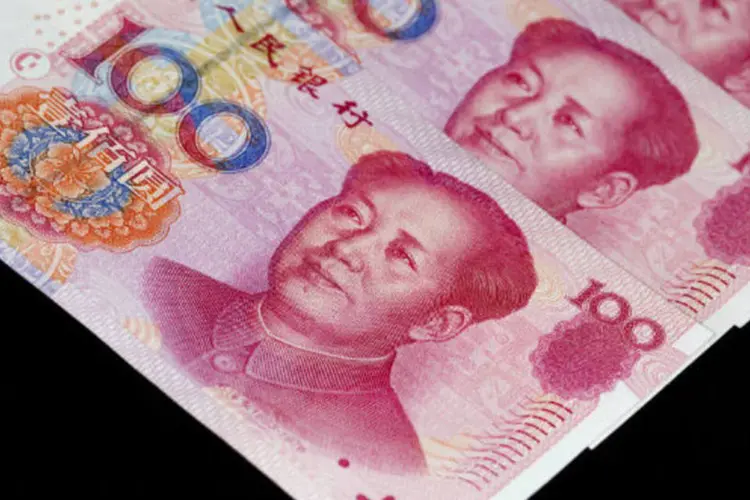 
	Iuane: a moeda chinesa est&aacute; sob press&atilde;o
 (Jerome Favre/Bloomberg)