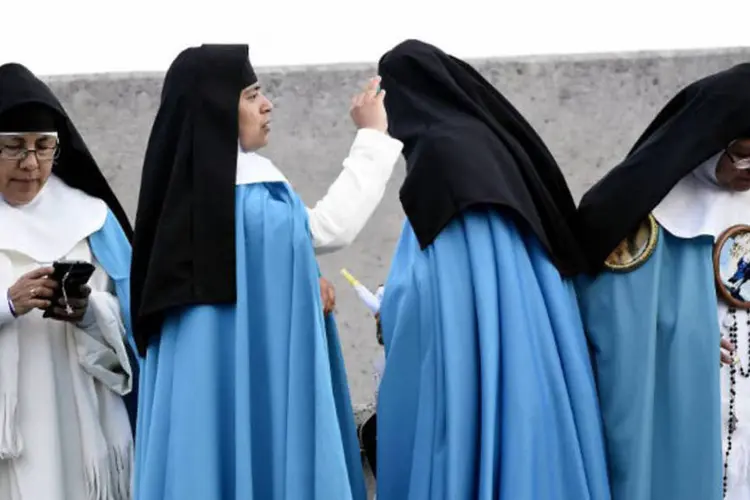Mulheres: a Igreja Católica diz que mulheres não podem ser ordenadas porque Jesus escolheu somente homens como apóstolos (Alfredo Estrella / AFP)