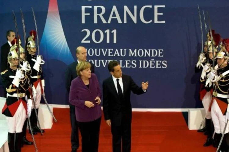 Merkel, Sarkozy e Lagarde (FMI) devem pressionar Papandreou, da Grécia, sobre referendo (David Ramos/Getty Images)