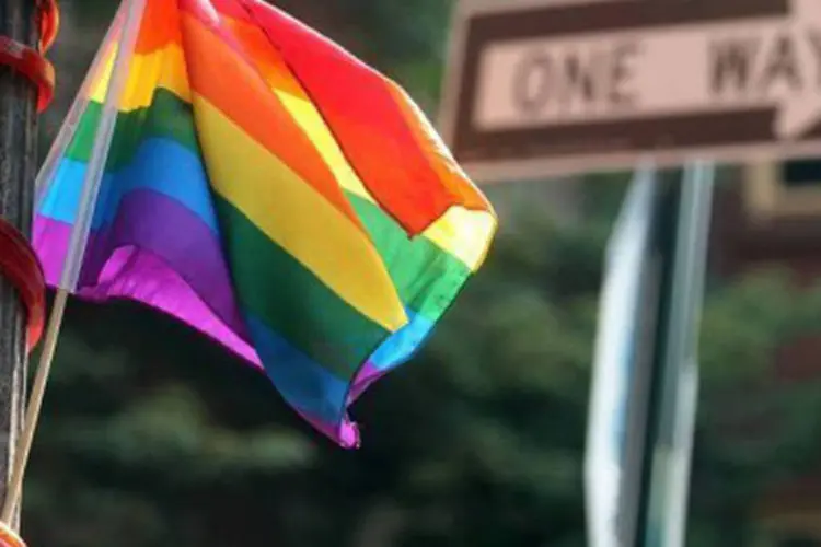 
	Bandeira com arco-&iacute;ris: Programa diz que compromisso com a defesa dos direitos civis dos homossexuais permanece
 (Mario Tama/Getty Images/AFP)