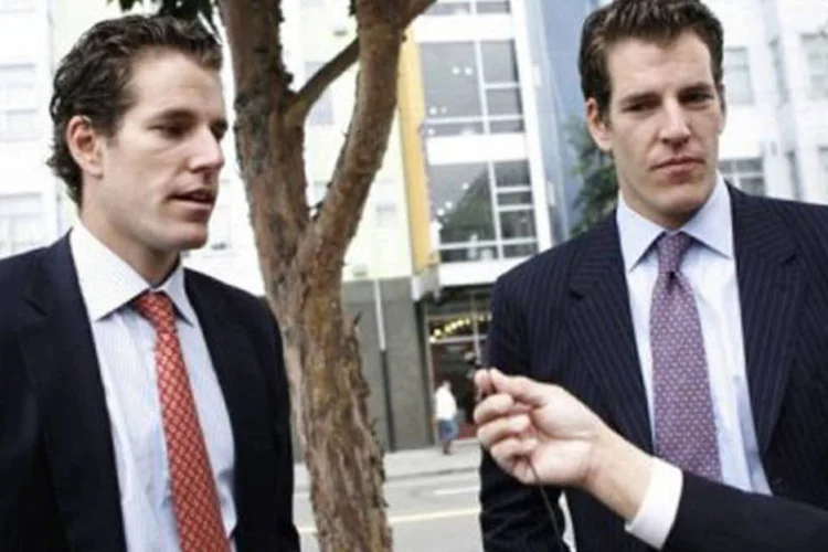 Cameron (à esquerda) e Tyler Cameron: na Justiça para receber mais que o acordo de US$ 65 milhões (Kimihiro Hoshino/AFP)