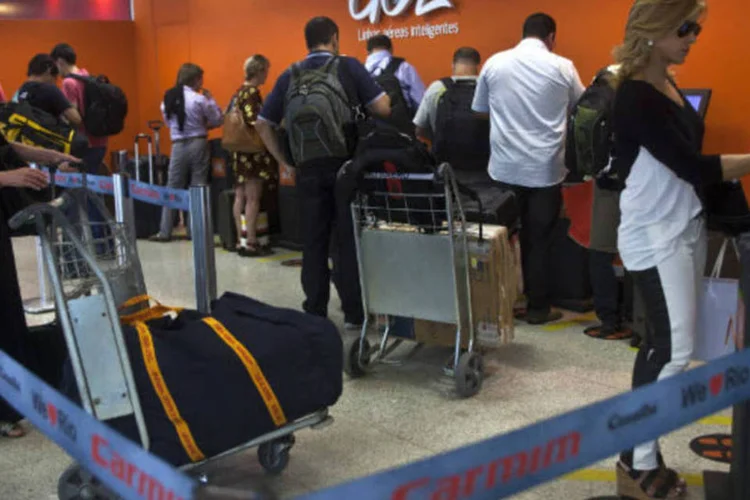
	GOL: &quot;Muitas pessoas ainda n&atilde;o t&ecirc;m cart&atilde;o de cr&eacute;dito, principalmente nas classes C e D, mas h&aacute; tamb&eacute;m clientes de alta renda que n&atilde;o usam o cr&eacute;dito&quot;, dissegerente da empresa
 (Dado Galdieri/Bloomberg)