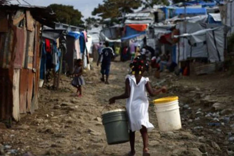 
	O Haiti se recupera pouco a pouco dos danos provocados pelo furac&atilde;o
 (Hector Retamal/AFP)