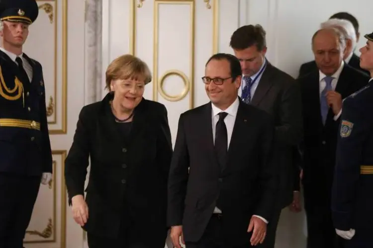 
	Merkel e Hollande: &quot;Desejamos que as negocia&ccedil;&otilde;es terminem com sucesso, mas ainda n&atilde;o se conseguiu&quot;, lembrou Merkel
 (Reuters)