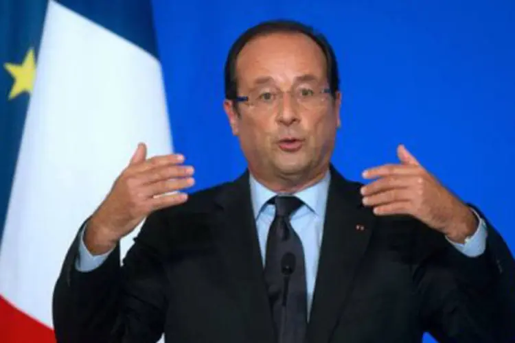 
	O presidente franc&ecirc;s, Fran&ccedil;ois Hollande: Rajoy e Hollande aproveitaram a ocasi&atilde;o para defender o euro e afirmar que a moeda &uacute;nica &eacute; um projeto&nbsp;&quot;irrevers&iacute;vel&quot;
 (©AFP / Bertrand Langlois)