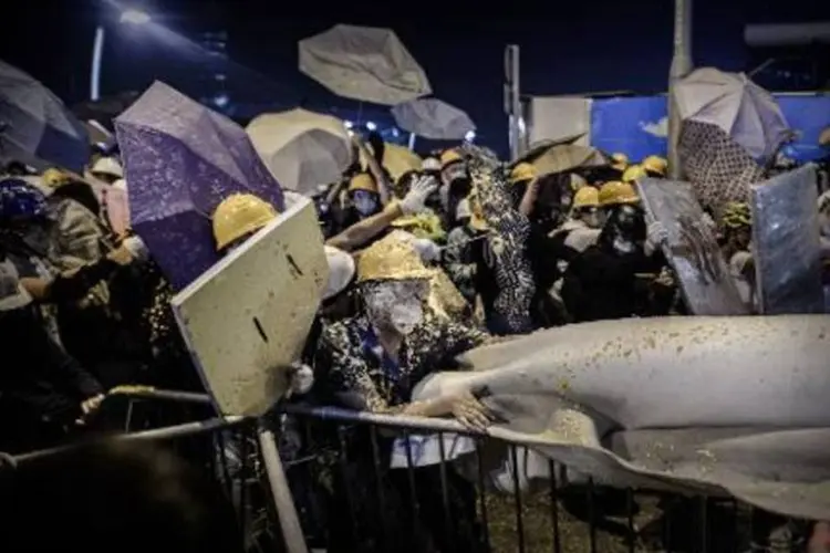 
	Hong Kong: porta-voz do Minist&eacute;rio chin&ecirc;s das Rela&ccedil;&otilde;es Exteriores declarou que Pequim &eacute; respons&aacute;vel pela pol&iacute;tica externa de Hong Kong
 (Philippe Lopez/AFP)