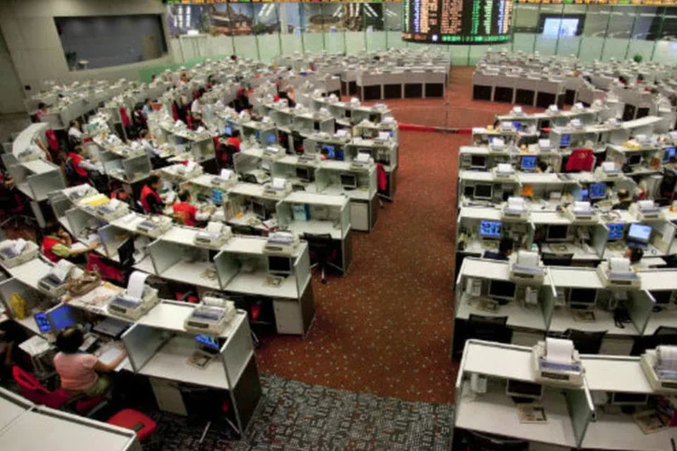 
	Bolsa de Hong Kong: houve tamb&eacute;m algumas m&aacute;s not&iacute;cias especificamente para a &Aacute;sia
 (Jerome Favre/Bloomberg)