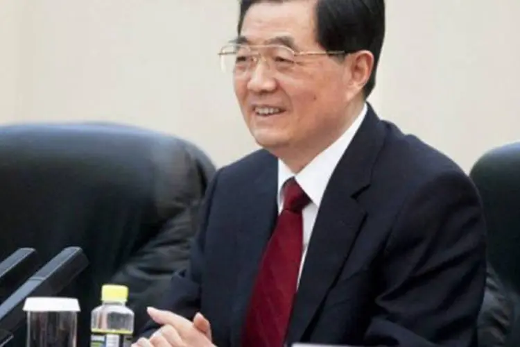 
	O ex-presidente chin&ecirc;s, Hu Jintao: justi&ccedil;a espanhola decide retirar a queixa por genoc&iacute;dio dele e de Jiang Zemin
 (Diego Azubel/AFP)