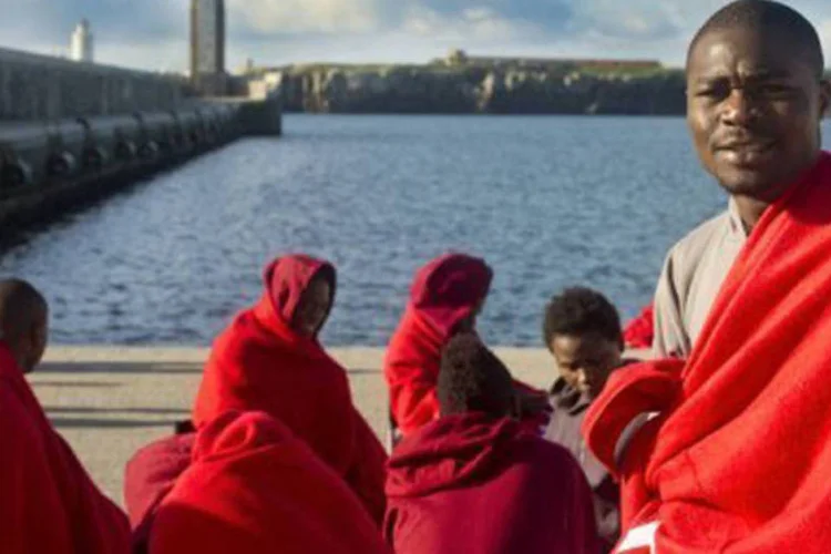 
	Imigrantes que tentaram entrar de forma clandestina na Espanha, no porto de Tarifa, em 2011
 (Marcos Moreno/AFP)
