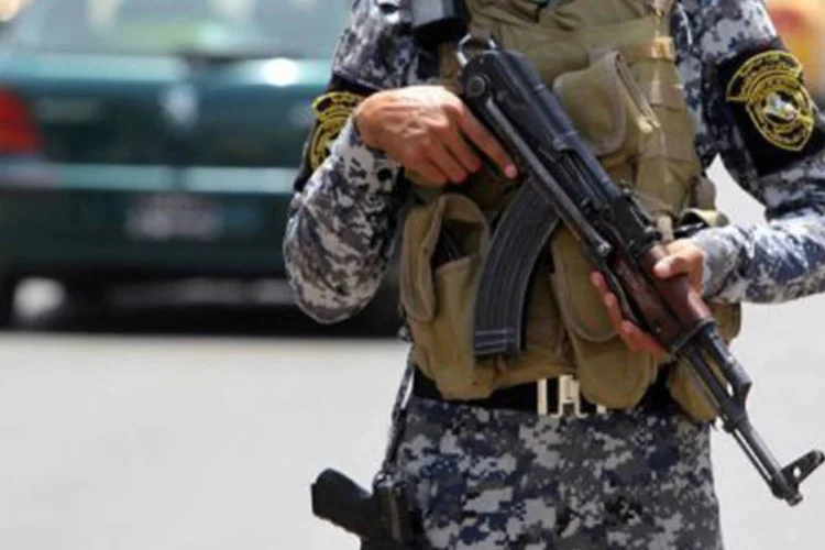 
	Policial iraquiano monta guarda em posto de controle em Bagd&aacute;: o pa&iacute;s j&aacute; determinou v&aacute;rias execu&ccedil;&otilde;es em grupo em 2012
 (Ahmad al-Rubaye/AFP)