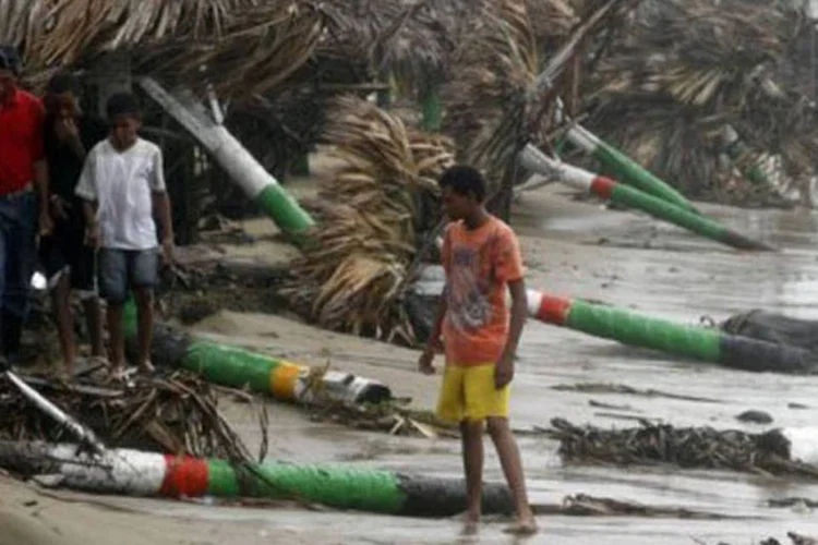 
	Estragos deixados pelo Irene: Ap&oacute;s a passagem de &#39;&#39;Isaac&#39;&#39;, a previs&atilde;o meteorol&oacute;gica indica que as chuvas perderam intensidade e frequ&ecirc;ncia
 (Erika Santelices/AFP)