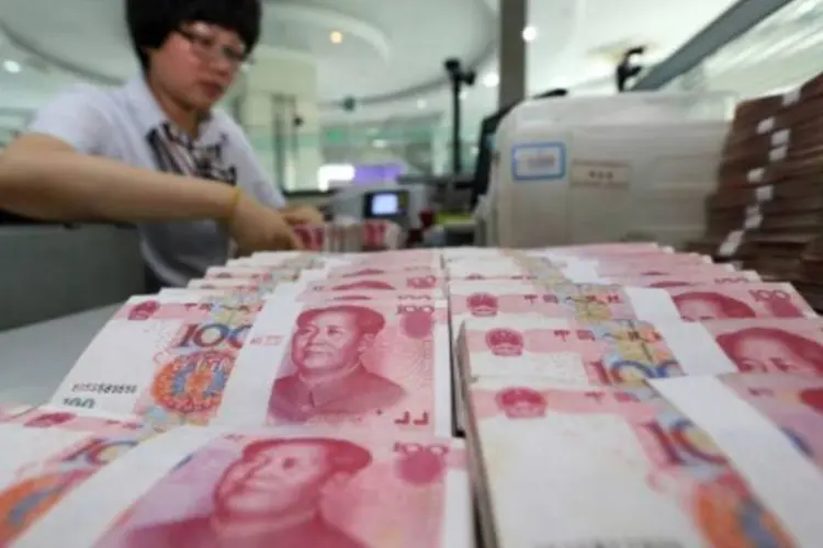 
	Iuane: a desacelera&ccedil;&atilde;o econ&ocirc;mica contribuiu para a fraqueza da moeda chinesa ao longo de 2015
 (AFP)