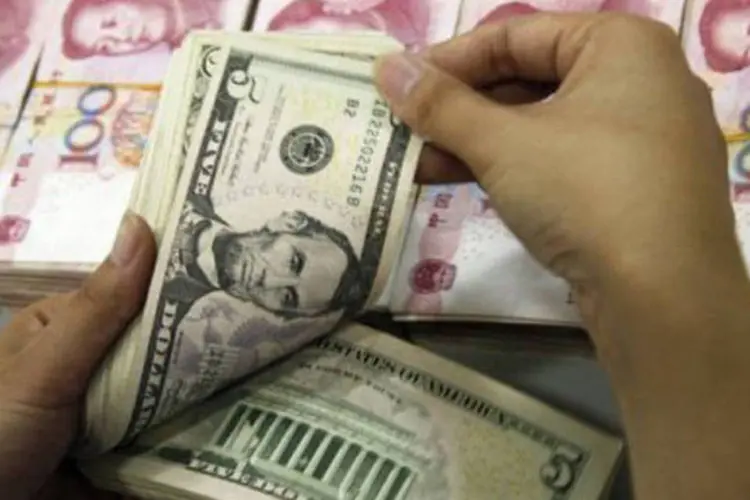 
	A China adquiriu US$ 157,1 bilh&otilde;es de reservas internacionais no primeiro trimestre, disse o comunicado
 (AFP)
