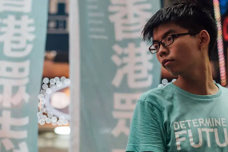 
	Joshua Wong: o l&iacute;der estudantil, que atualmente tem 19 anos, pode ser condenado a at&eacute; cinco anos de pris&atilde;o
 (Anthony Kwan / Stringer / Getty Images)