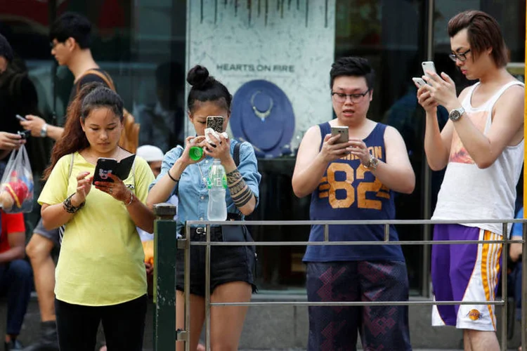 
	Pok&eacute;mon Go em Hong Kong: At&eacute; o momento, a pol&iacute;cia evitou se pronunciar sobre essas concentra&ccedil;&otilde;es de &quot;pokeman&iacute;acos&quot;
 (Bobby Yip / Reuters)