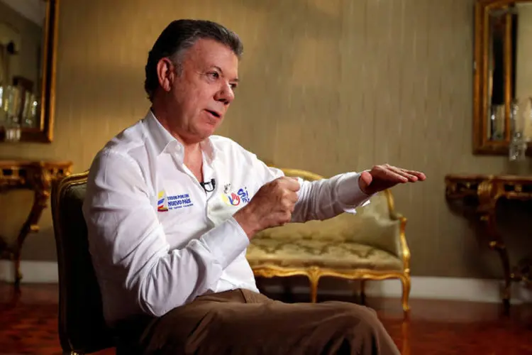 
	Juan Manuel Santos: &quot;Se o &#39;n&atilde;o&#39; vencer, voltaremos ao que t&iacute;nhamos no come&ccedil;o deste governo, seis anos atr&aacute;s. Voltamos ao conflito armado&quot;
 (John Vizcaino / Reuters)