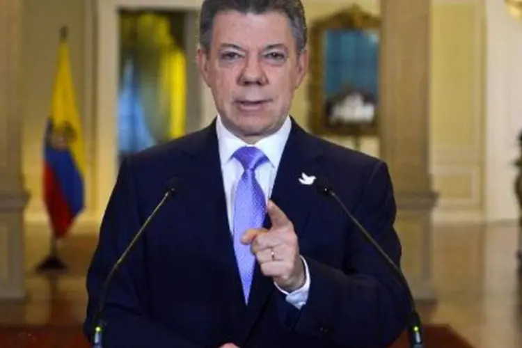 
	Juan Manuel Santos: o governo e as Farc alcan&ccedil;aram um acordo de paz depois de quase quatro anos de di&aacute;logos
 (HO/AFP)