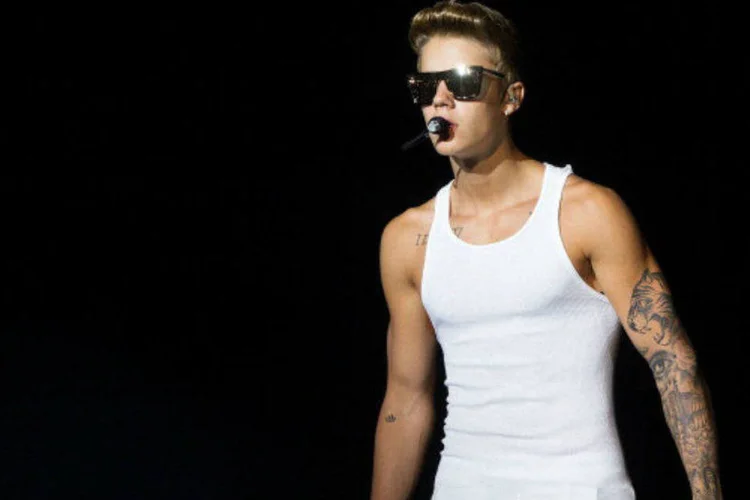 
	Justin: o empres&aacute;rio do cantor e a ag&ecirc;ncia que cuida de sua imagem amea&ccedil;aram deix&aacute;-lo se ele participasse do evento
 (Nicky Loh/Getty Images)