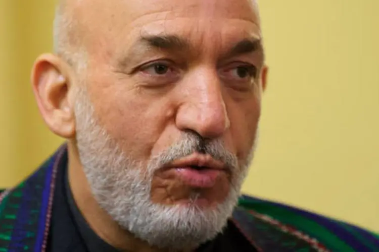 
	Hamid Karzai, presidente do Afeganist&atilde;o: &quot;os queremos no Afeganist&atilde;o logo que for poss&iacute;vel&quot;, disse
 (Mandel Ngan/AFP)