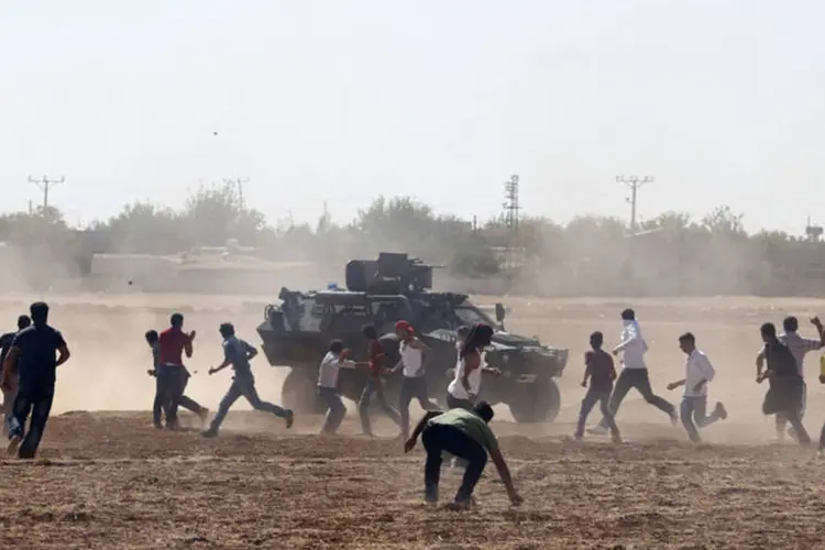 
	Cidade s&iacute;ria de Kobane: EI vem tentando tomar Kobane h&aacute; tr&ecirc;s semanas
 (Umit Bektas/Reuters)