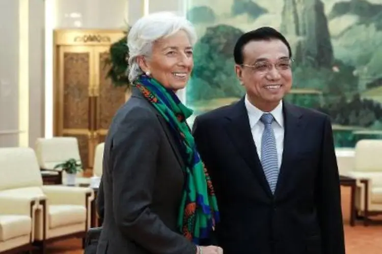 Christine Lagarde é recebida pelo vice-premier chinês, Li Keqiang, em Pequim (Lintao Zhang/AFP)
