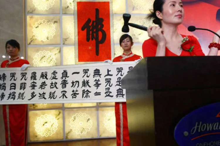 Leilão na China: foram US$ 10,834 bilhões em "vendas voluntárias" no ano passado (China Photos/Getty Images)