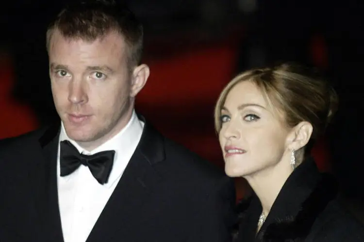 
	Madonna e Guy Richie: a artista abriu nos Estados Unidos um processo para que seu filho Rocco volte a viver com ela
 (Kevin Coombs / Reuters)
