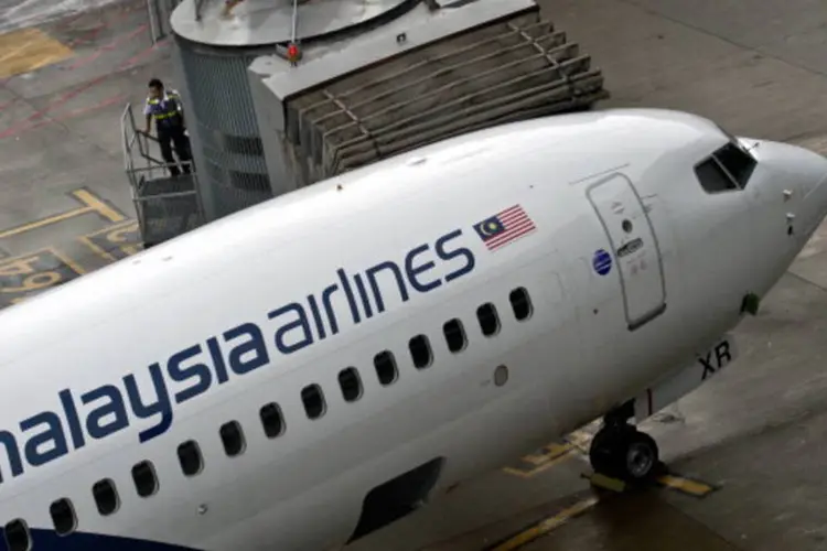 
	Aeronave da Malaysia Airlines: bancos perceberam a retirada do dinheiro em 18 de julho
 (AFP/Getty Images)