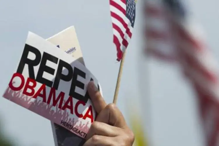 Manifestante pelo "Obamacare": a Suprema Corte dos Estados Unidos validou quase integralmente nesta quinta-feira a reforma da saúde (©AFP / Saul Loeb)