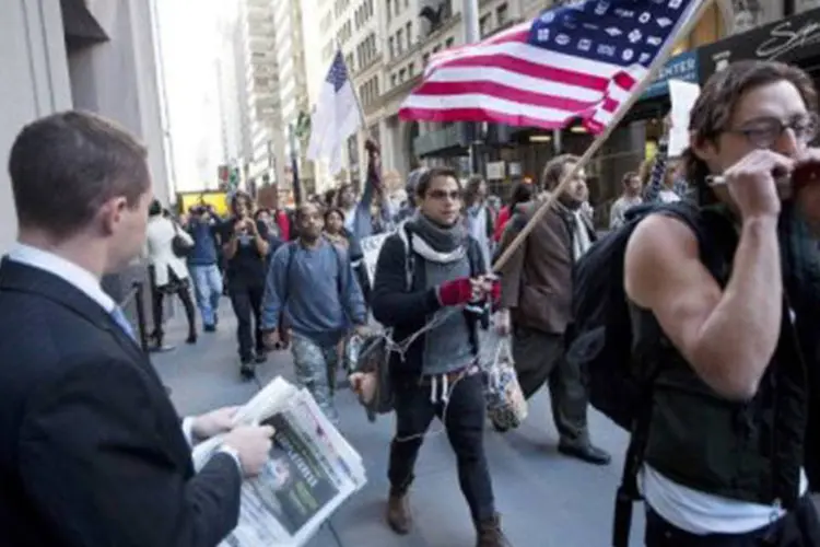 Manifestantes protestam contra o sistema internacional em Nova York
 (Michael Nagle/Getty Images/AFP)