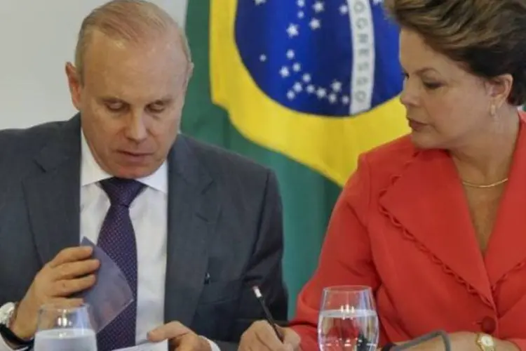 
	O ministro da Fazenda, Guido Mantega, com a presidente Dilma Rousseff
 (Antonio Cruz/ABr)
