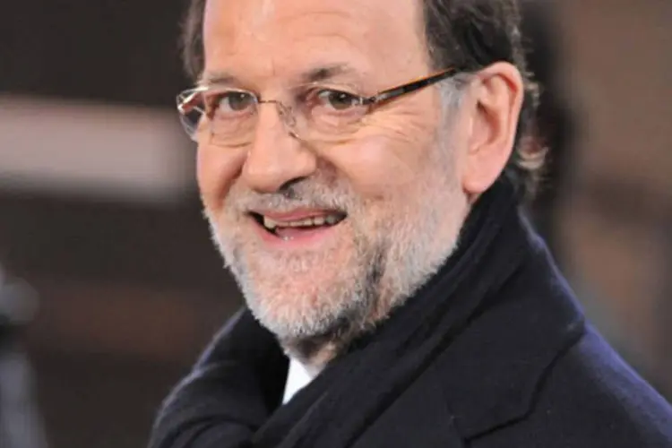 
	Mariano Rajoy: premi&ecirc; nega ter cometido qualquer irregularidade no esc&acirc;ndalo, que envolve den&uacute;ncias de doa&ccedil;&otilde;es ilegais feitas por magnatas da constru&ccedil;&atilde;o civil
 (AFP/ Georges Gobet)