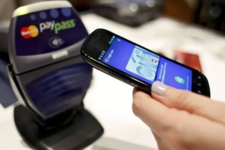 As empresas irão combinar a tecnologia com a plataforma de sistema de pagamentos móveis da mFoundry para clientes com celulares NFC (Brian Ach/Getty Images)
