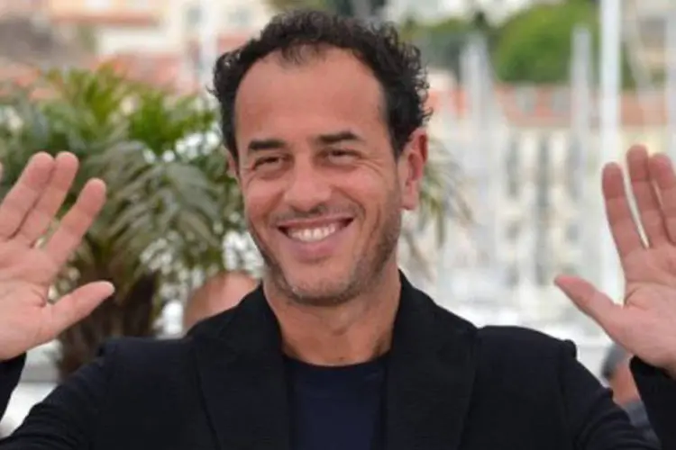 Matteo Garrone, diretor de "Reality", posa para fotos em Cannes: "Aniello Arena não pôde vir a Cannes porque está na prisão há 18 anos", explicou
 (Alberto Pizzoli/AFP)