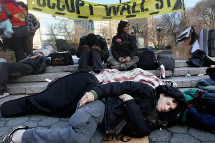 
	Membro do Ocupe Wall Street nos EUA: 2.600 pris&otilde;es ligadas ao movimento foram feitas em Manhattan no dia 1o de outubro
 (Mario Tama)