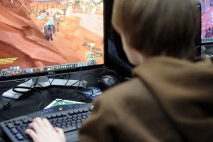 Menino jogando "World of Warcraft" na feira CeBit em março: o ataque aparentemente começou no domingo, segundo os membros do fórum online WoW Insider (©DDP/AFP / Nigel Treblin)