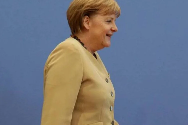 
	&quot;N&atilde;o &eacute; da nossa al&ccedil;ada (os pol&iacute;ticos) estabelecer os limites ... Isso &eacute; do dom&iacute;nio do BCE&quot;, afirmou Merkel
 (Tobias Schwarz/Reuters)